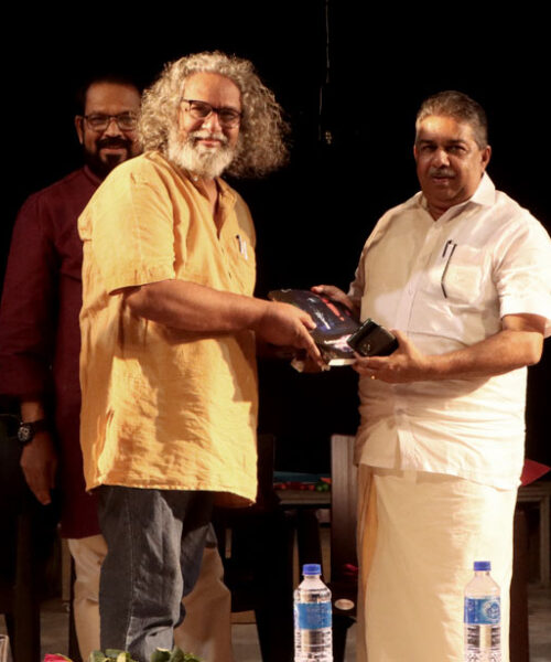 Saji Cherian, Minister for fisheries, culture & youth affairs receive memento from Dr Chandradasan at Lokadharmi's 26th Annual Day and World Theatre Day 2023 event, at Lokadharmi Nadakaveenu